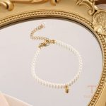 ست گردنبند و دستبند وینتیج با مروارید از استیل ضدزنگ و آبکاری طلای ۱۸ عیار برند مایا استون - تصویر 8